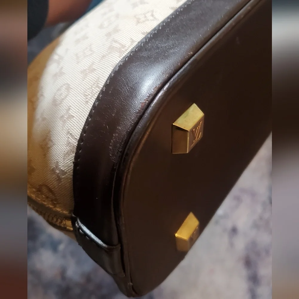 Louis Vuitton Alma Brown Mini Lin Monogram Handbag